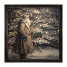 Santa near Lit Christmas Tree